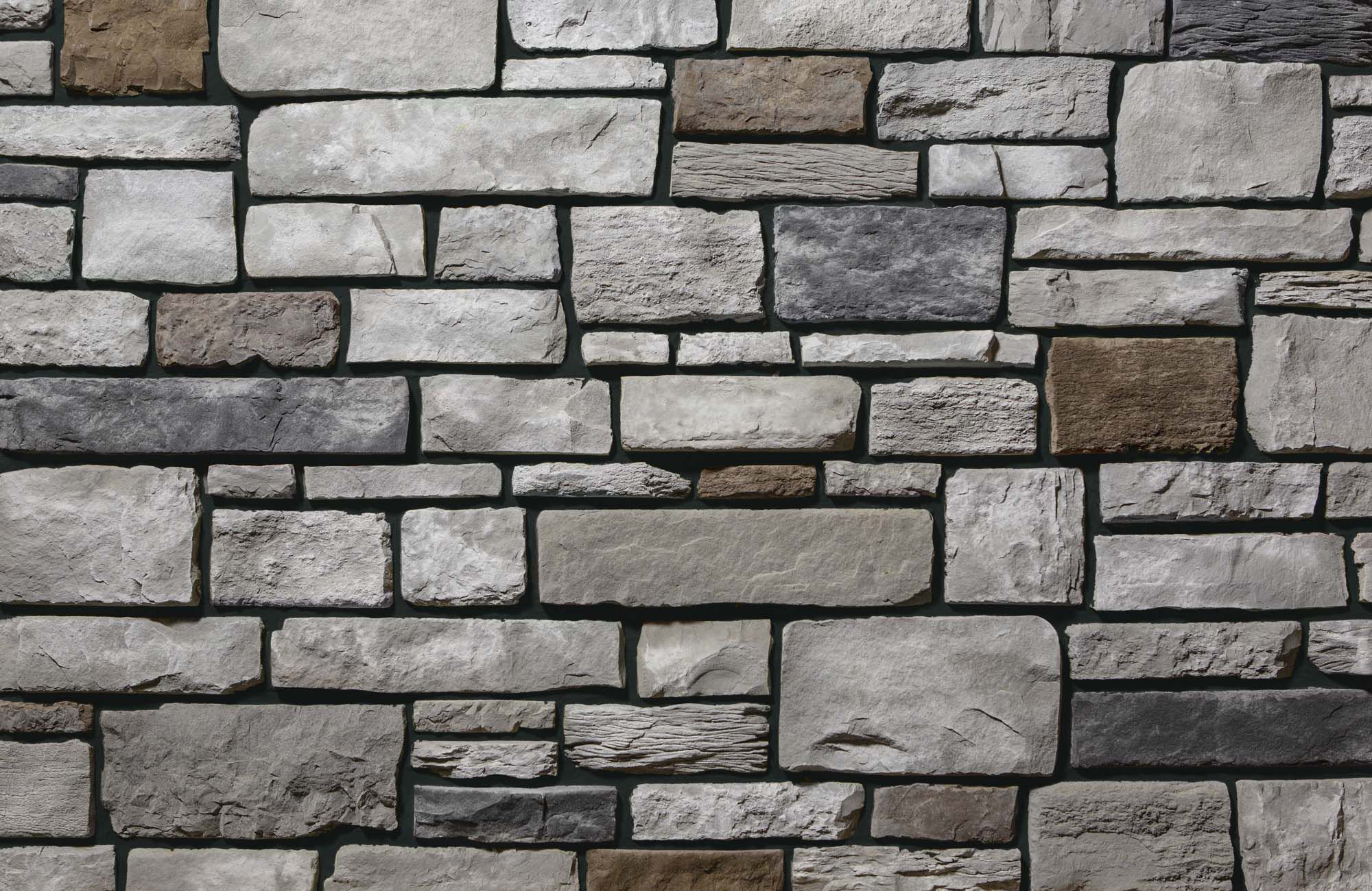 Add depth and detail to your home office with thin stone veneer and black grout. Add depth and detail to your home office with thin stone veneer and black grout.